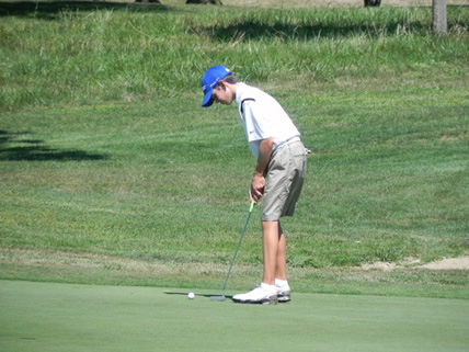 Freshman Will Grimmer steps up to a putt, leading the Warriors to a win over Moeller earlier this year.  (PHOTO by Long)