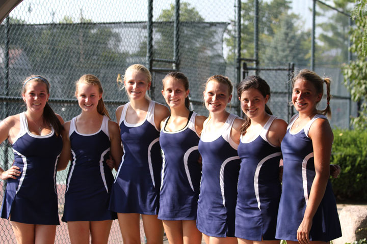 The varsity girls tennis team poses for a picture in front of their home courts in Mariemont.  (PHOTO by Zach)