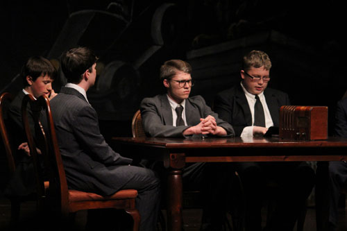 While President Roosevelt (played by Ben Gorman) and his cabinet (Josh Keys, Jonathan Dietz, and Kyle Matz) look serious, they had to hold back laughter when recieving telegrams with Mr. Goetzs face on them. (Photo taken from mariemontschools.org)