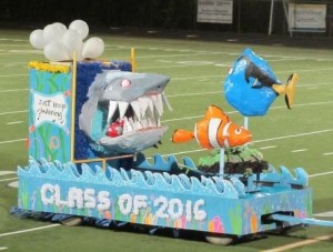 (PHOTO BY TIMMERS) Last year's freshman float as it crosses the field.