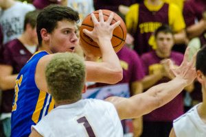 Junior forward Brennan Crowley looks for an open teammate. Crowley finished the season averaging 14.8 points, 8 rebounds, and 2.1 assists a game. (PHOTO BY SPOONER)