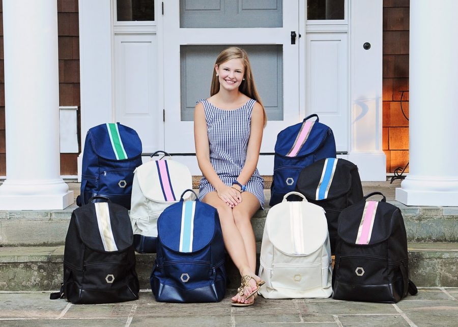 Madeline Falknor posing with her backpacks. 
ILLISTRATION FROM MADELINE AND COMPANY WEBSITE