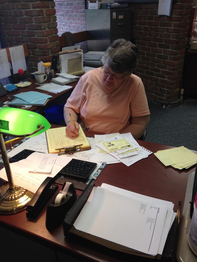Douthit has perfected her handwriting in her 37 years at Mariemont. (PHOTO BY KROMER)