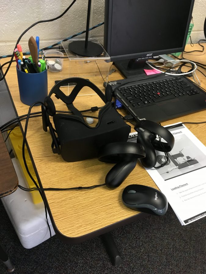 The Oculus headset and control sitting unused on the library table. (PHOTO BY PAYIATIS)