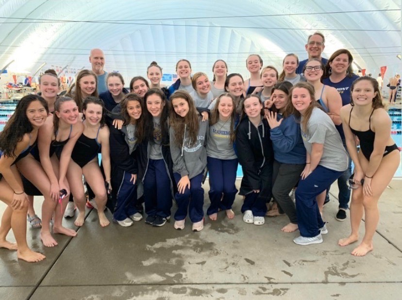 (IMAGE FROM BONNELL) The Girls Swim Team poses following Districts.