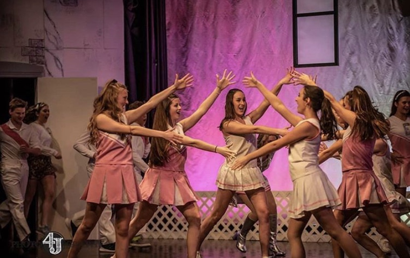 Members of the ensemble and Delta Nus dancing during the song What You Want (PHOTO BY Four Js Photography) 