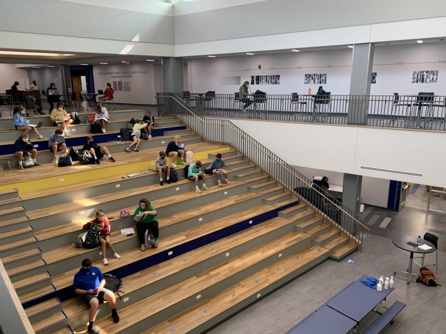 Students on the stairs of the new hub (BY NATALEE SHRIVER)